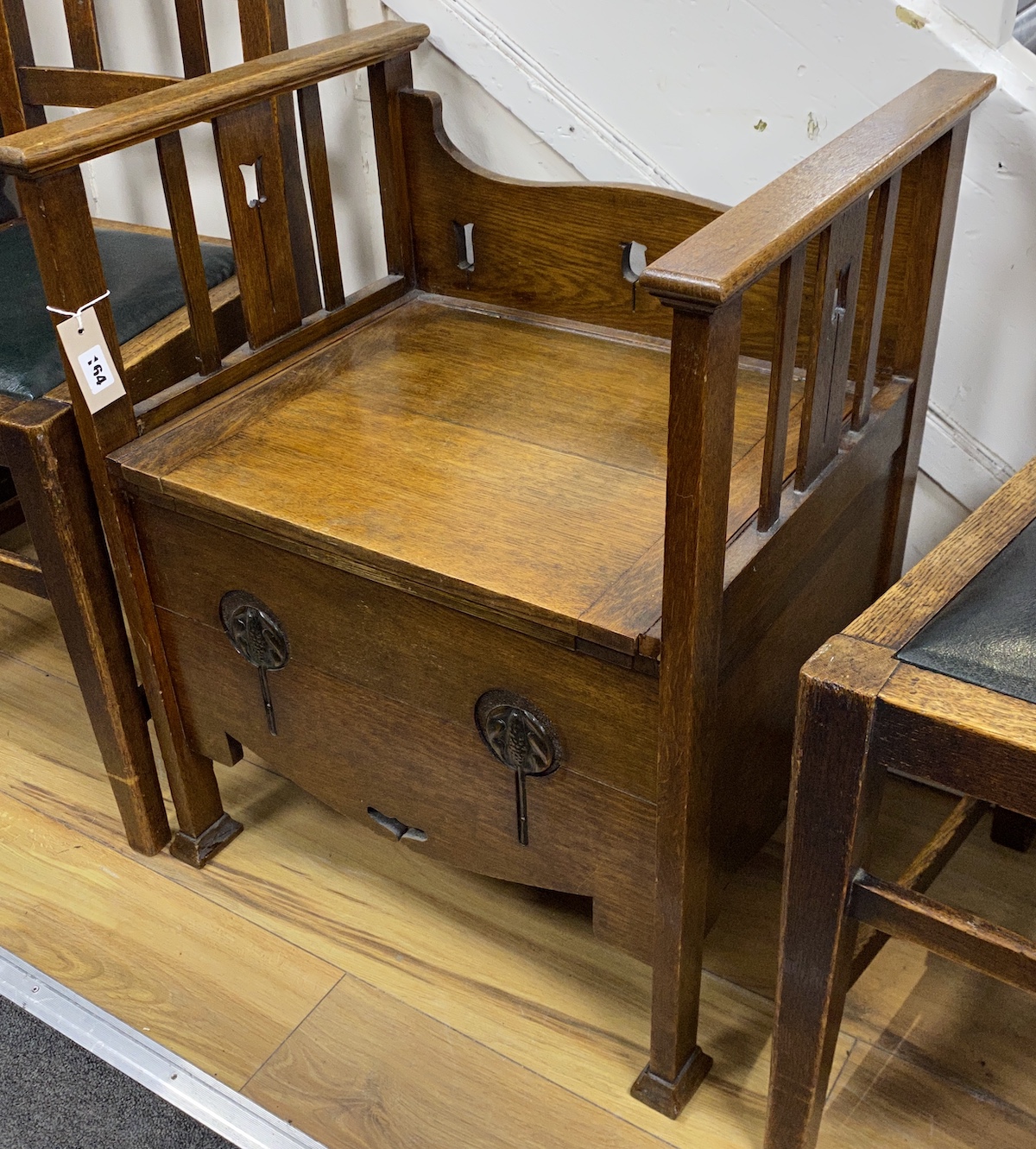 An Art Nouveau copper mounted oak commode, width 55cm, depth 45cm, height